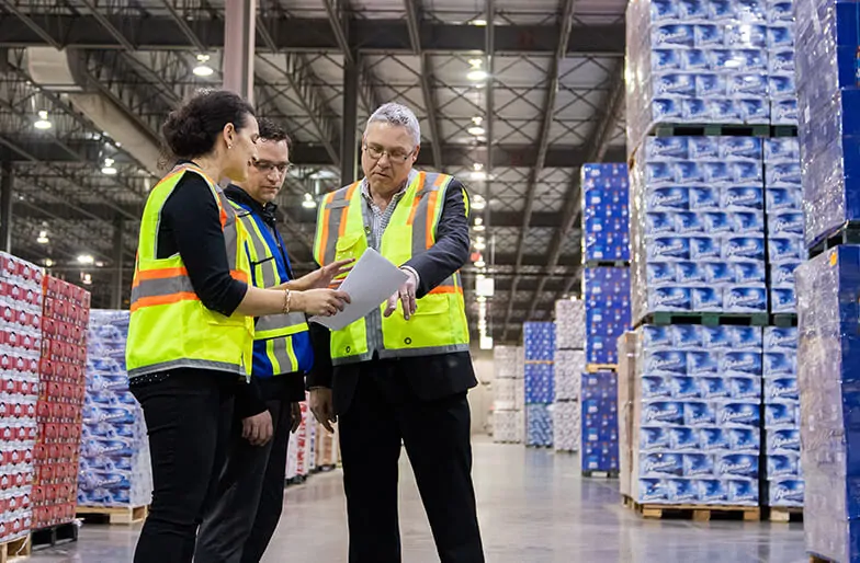 Client tour through MTE Logistix Edmonton warehouse explaining warehouse services and 3PL solutions